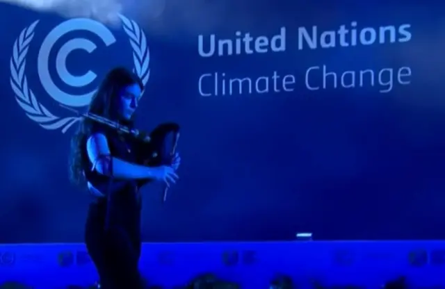 Bagpiper Brìghde Chaimbeul plays on the stage at COP26