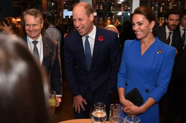 Britain's Catherine, Duchess of Cambridge (C) and Britain's Prince William, Duke of Cambridge (R) speak with guests at a reception for the key members of the Sustainable Markets Initiative and the Winners and Finalists of the first Earthshot Prize Awards at the Clydeside Distillery, on the sidelines of the COP26 UN Climate Change Conference in Glasgow, Scotland on November 1, 2021.