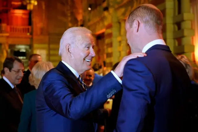 US President Joe Biden greets Prince William at a reception to mark the opening day of COP26