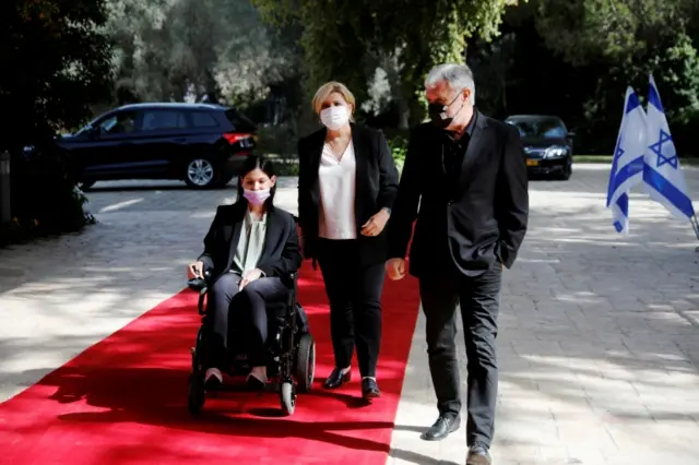 Karine Elharrar, Orna Barbivai and Meir Cohen from the Yesh Atid party arrive for consultations on the formation of a coalition government, at the President"s residence in Jerusalem April