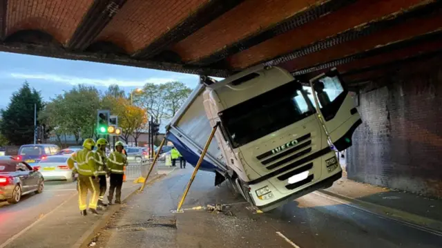 HGV stuck under rail bridge