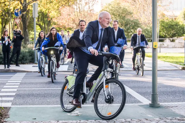 Frans Timmermans on a bike