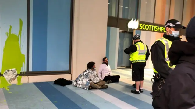 Police deal with protestors outside Scottish Power