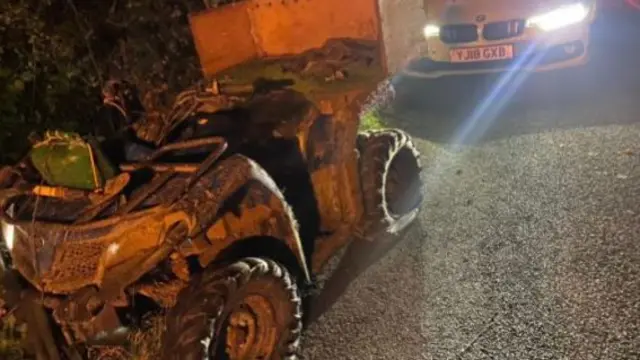 Quad bike and police car