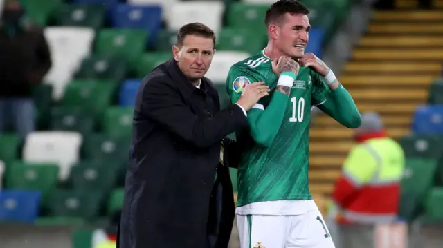 NI manager Ian Baraclough consoles Kyle Lafferty after the play-off final defeat by Slovakia one year ago today