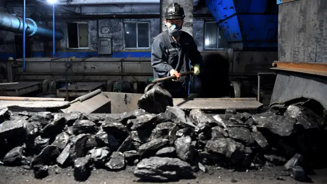 Workers sort coal at Qianyingzi coal mine in Suzhou, east China's Anhui Province