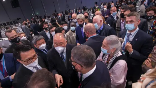 A huddle on the conference floor