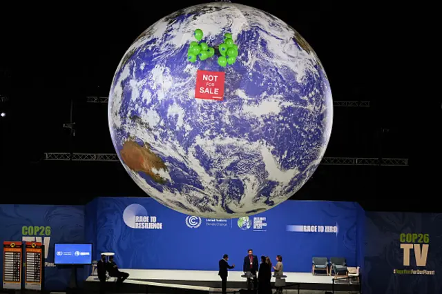 A display of the earth marked "not for sale" at COP26