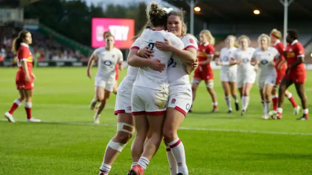 Leanne Infante and Claudia MacDonald celebrate a try