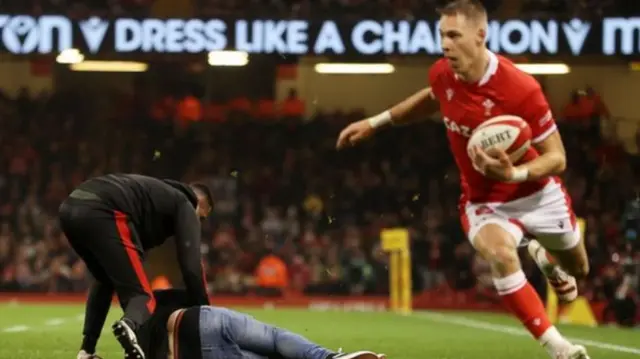 Liam Williams with fan on pitch