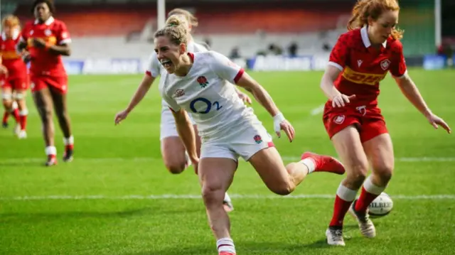 Claudia MacDonald celebrates a try