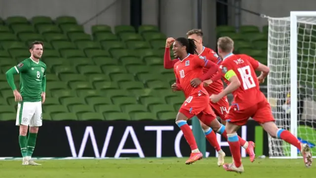 Gerson Rodrigues of Luxembourg celebrates after scoring their team's first goal as Alan Browne of Republic of Ireland looks on