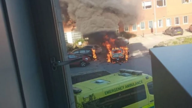 The taxi on fire outside the hospital