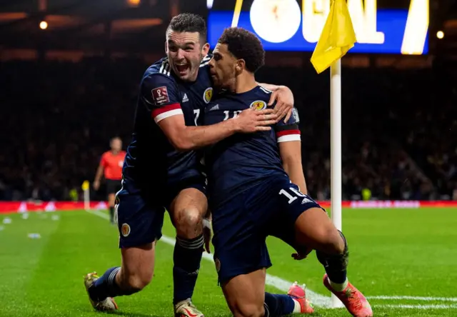 John McGinn celebrates with Che Adams after the striker made it 2-0 late in the second half