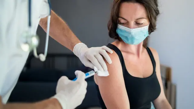 Woman getting vaccine