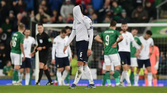 Dejected Italy players