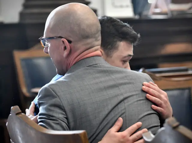 Kyle Rittenhouse hugs his lawyer after the verdict is read