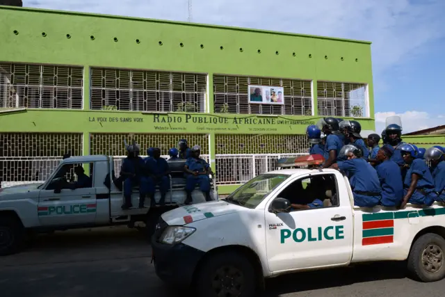 Burundian riot police drive past the offices of the main independent radio station African Public Radio (RPA) in Bujumbura in 2015