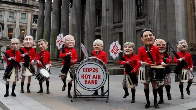 Pipe band wearing masks of world leaders in Glasgow