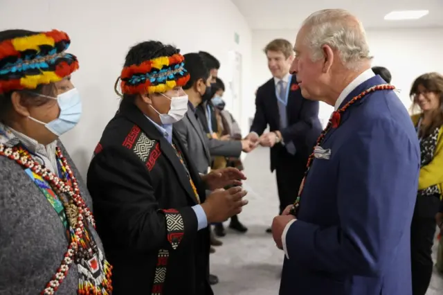 Prince Charles speaks to the general co-ordinator of the Global Alliance of Territorial Communities Tuntiak Kata