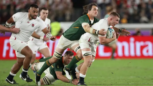 England's Sam Underhill is tackled by South Africa's Franco Mostert