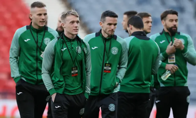 Hibs players gather on the Hampden turf