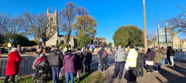 Members of the public listened intently to the service from outside the church as it was relayed by loudspeakers