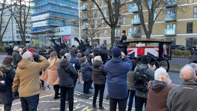 Members of the public broke into spontaneous applause as the horse-drawn hearse passed the Civic Centre