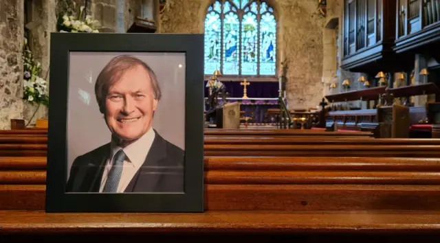 A copy of Sir David's photograph inside the church