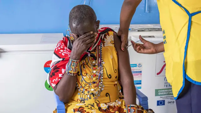 Maasai woman is inoculated with a Moderna Covid-19 vaccine at Oltepesi Dispensary in Kajiado, Kenya, on 9 September, 2021.