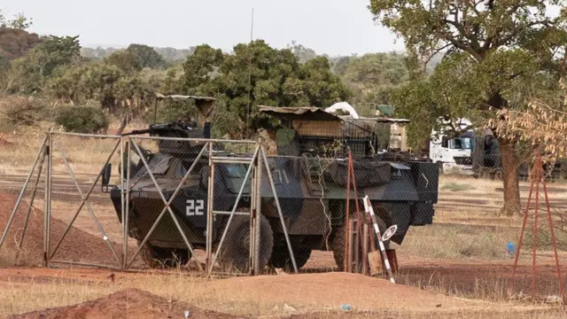 A French armoured vehicle is parked at the entrance of the site where French vehicles convoy are parked in Kaya, capital of Burkina Faso's north-central region, after people protest to oppose the passage of a large French army logistics convoy in transit to neighboring Niger, on November 20, 2021.