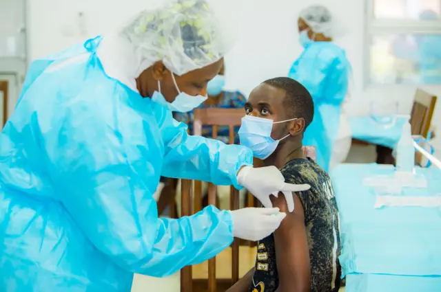 A man receives coronavirus (Covid-19) vaccine as part of the vaccination campaign for health workers and people over 65 years old at Kibagabaga Hospital in Kigali, Rwanda