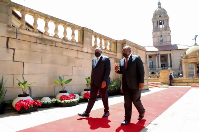 President Cyril Ramaphosa walks with Kenya"s President Uhuru Kenyatta during his state visit at the government"s Union Buildings in Pretoria, South Africa, November 23, 2021.