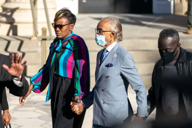 Wanda Cooper-Jones, Al Sharpton and Marcus Arbery walk together