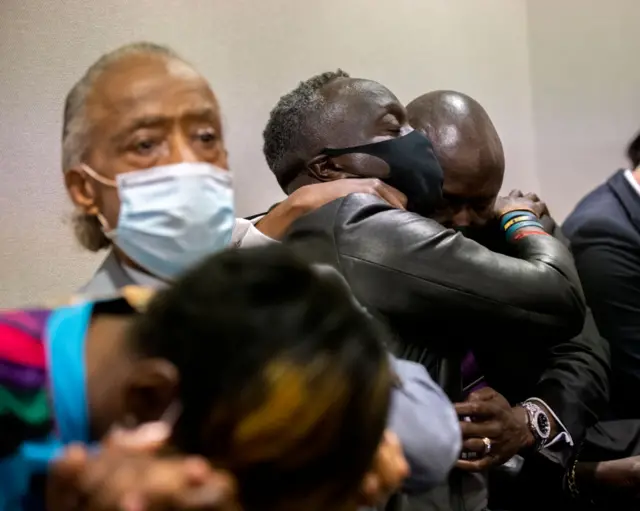 Marcus Arbery (centre) hugs family attorney Ben Crump as the jury verdict is delivered