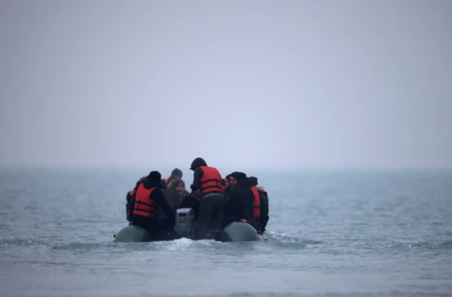 About 40 migrants crammed on an inflatable dingy leave the northern French coast to cross the channel