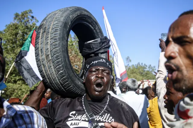 Man holding a tyre