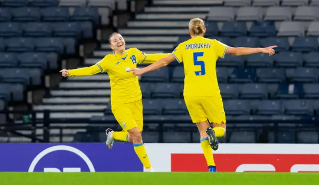 Ukraine's Roksolana Kravchuk (left) celebrates her goal