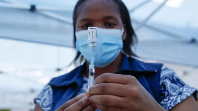 A healthcare worker prepares to administer a dose of the Covid vaccine in Laudium, Pretoria