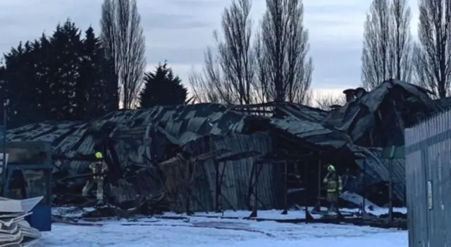 Blackened factory after the fire