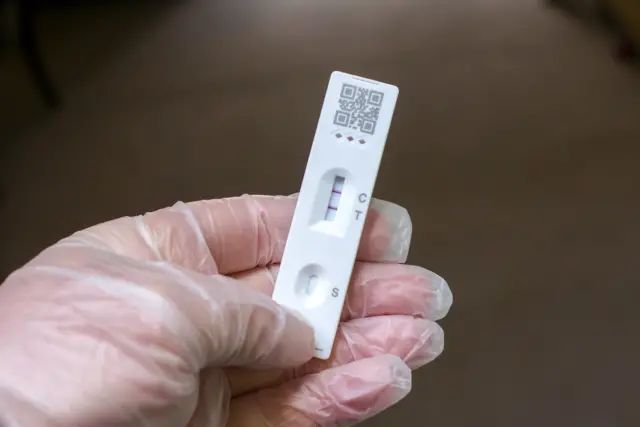 Lateral flow test showing positive Covid result