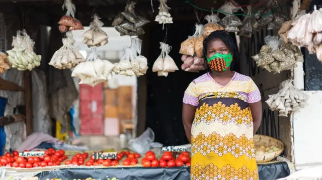 A woman at a market store in Zambia