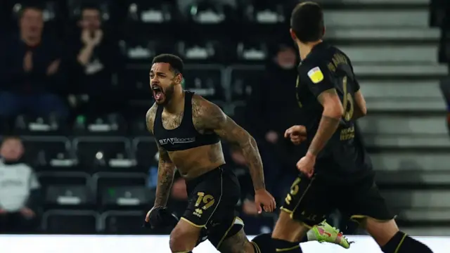 Andre Gray celebrates