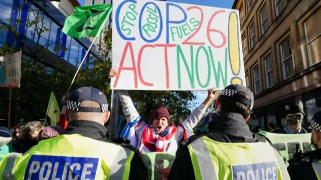 A climate protester in Glasgow