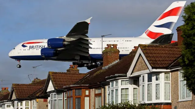 A BA jet over some houses