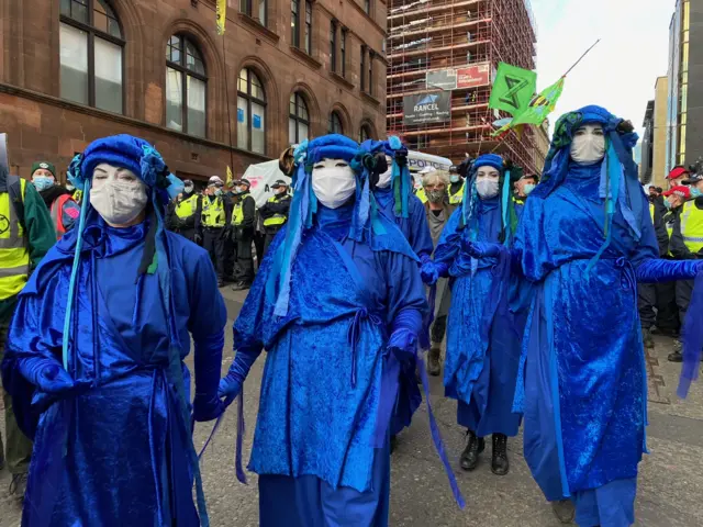 XR protesters dressed in blue