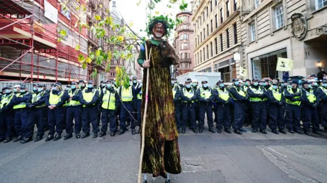 Protester dressed as a tree