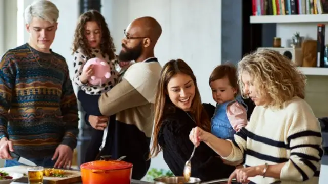 A family gathers to cook dinner