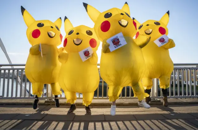 Protesters dressed as the Pokemon Pikachu