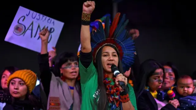 Indigenous people chant as they attend the Fridays for Future march